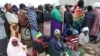 Zimbabweans wait to cast their vote in Presidential and parliamentary elections in the Southern African Nation in Harare, July, 31, 2013. 