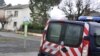 A French police vehicle is parked near a house where an alleged jihadist was arrested earlier on December 15, 2014, in Graulhet, southwestern France.