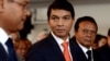 Madagascar's transitional leader Andry Rajoelina (C) attends a ceremony at Antananarivo's Town Hall to commemorate the students' unrest in 1972 which led to the first Republic's fall, May 13, 2013. 