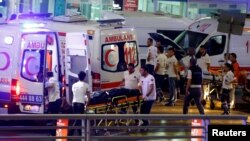 Ambulances arrive at Istanbul Ataturk Airport, Turkey, following explosions, June 28, 2016. 