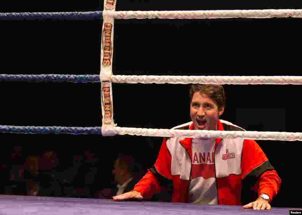 Canada's Prime Minister Justin Trudeau cheers during a charity boxing event in Montreal, Quebec, Aug. 23, 2017.