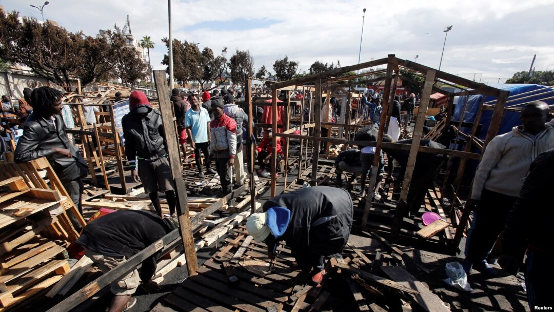 African migrants build a makeshift house after their houses burned, on the outskirts of Casablanca, Morocco, Oct. 29, 2018. 