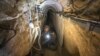 An Israeli army officer shows journalists a tunnel allegedly used by Palestinian militants for cross-border attacks from Gaza into Israel, July 25, 2014.