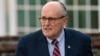 FILE - Former New York Mayor Rudy Giuliani arrives at the Trump National Golf Club Bedminster clubhouse in Bedminster, N.J., Nov. 20, 2016. President Donald Trump's new lawyer, Rudy Giuliani, said Wednesday the president repaid attorney Michael Cohen for a $130,000 payment to porn star Stormy Daniels.