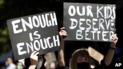 Thousands of people with placards and banners rally demanding justice for women in Sydney, March 15, 2021, as the government reels from two separate allegations.