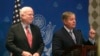 U.S. Senator Lindsey Graham (R) speaks as compatriot Senator John McCain looks on during a news conference in Cairo, August 6, 2013. 
