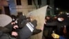Police try to block protesters who poured into the streets following the government's announcement that it would suspend talks on European Union accession, outside the parliament building in Tbilisi, Georgia, Nov. 29, 2024. 