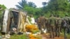 FILE - Congolese Defense Forces soldiers inspect the scene of an attack near the town of Oicha, 30 kms (20 miles) from Beni, Democratic Republic of Congo, July 23, 2021. 