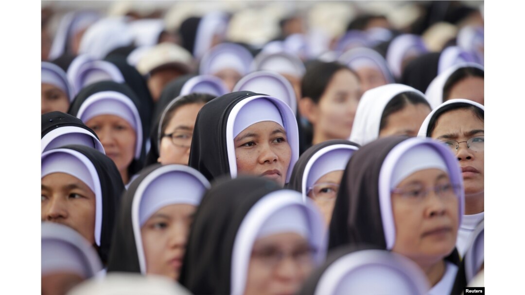 Catholic faithful attend a mass led by Pope Francis at Kyite Ka San Football Stadium in Yangon, Myanmar, Nov. 29, 2017.