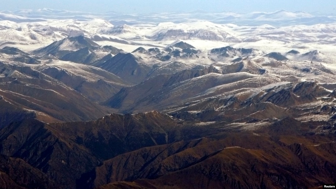 FILE - Tibetan Plateau in background of Himalayan range, viewed from flyover in Nepal.
