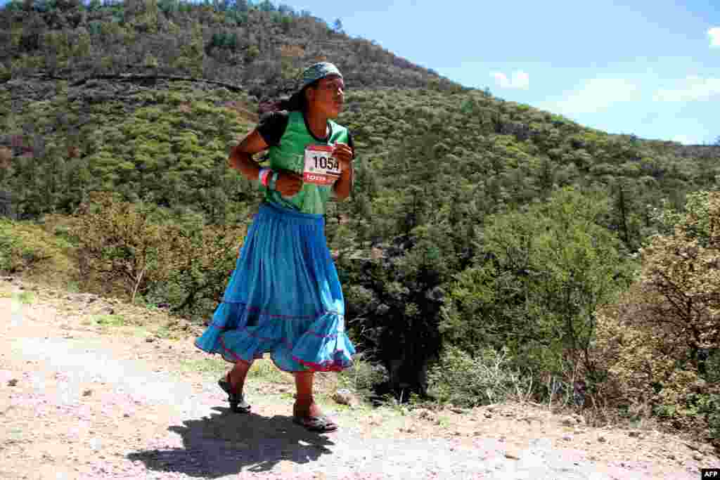 A Raramuris indigenous woman takes part in the "Ultra maraton de los Canones 2017" (Ultra marathon of the Canyons), at La Sinforosa Canyon, in Guachochi, Chihuahua state, Mexico, on July 15, 2017.