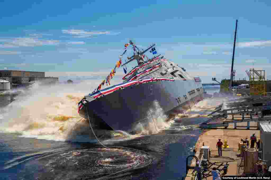 The U.S. Navy’s future USS Billings (LCS 15) launches sideways into the Menominee River in Marinette, Wisconsin, July 1, 2017, following its christening by ship sponsor Sharla Tester. Once commissioned, LCS-15 will be the first ship of its name in naval service.