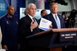 FILE - Vice President Mike Pence speaks as President Donald Trump listens during a press briefing with the coronavirus task force, at the White House, March 16, 2020, in Washington.