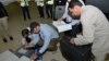 Samples brought back by the U.N. chemical weapons inspection team are checked in upon their arrival at The Hague, Netherlands, August 31, 2013.