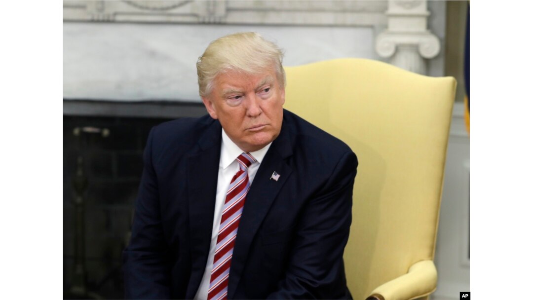 President Donald Trump talks to reporters in the Oval Office of the White House in Washington, May 10, 2017.