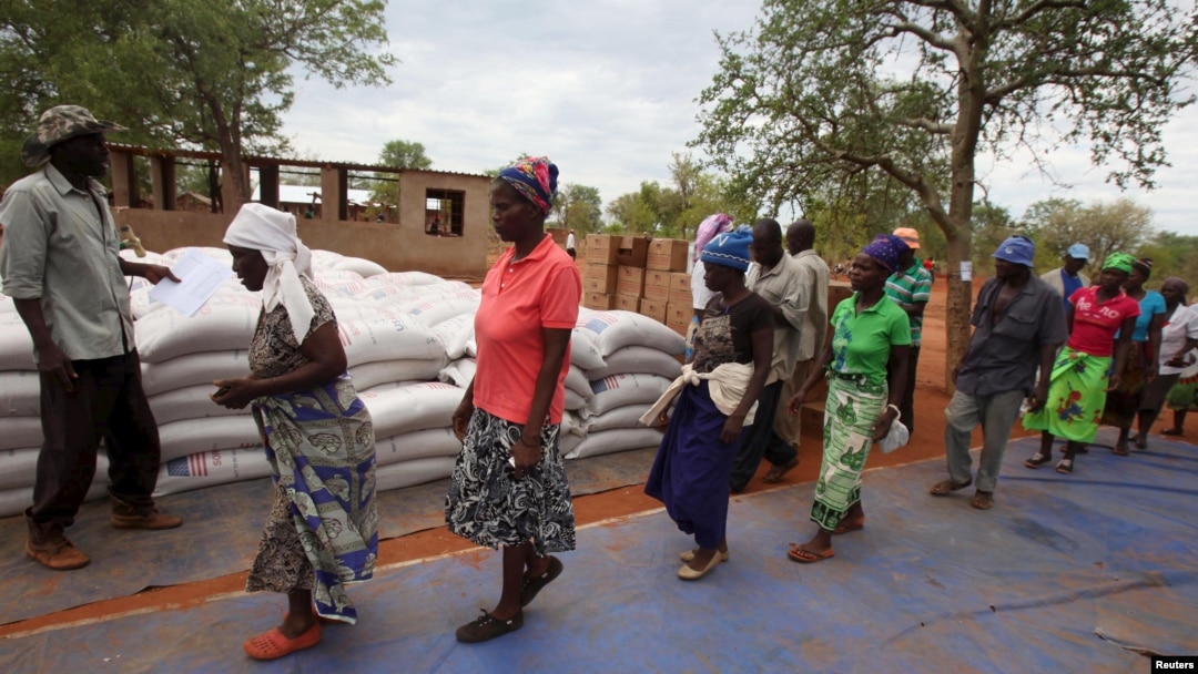 Villagers collect their monthly food ration provided by the United Nations World Food Program (WFP) in Masvingo, Zimbabwe, Jan. 25, 2016.