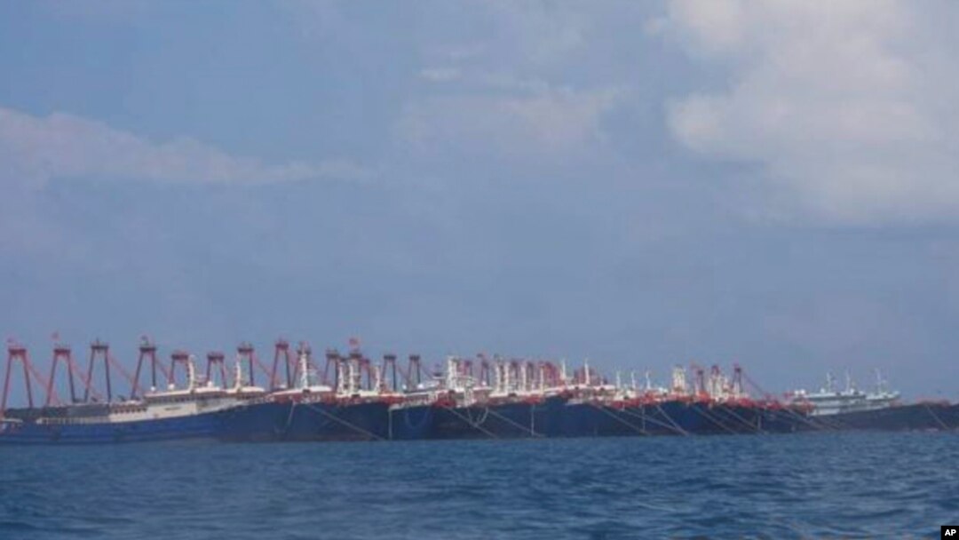 In this photo released March 21, 2021, by the Philippine Coast Guard/National Task Force-West Philippine Sea, some of the 220 Chinese vessels are seen moored at the Whitsun reef, South China Sea, March 7, 2021. 