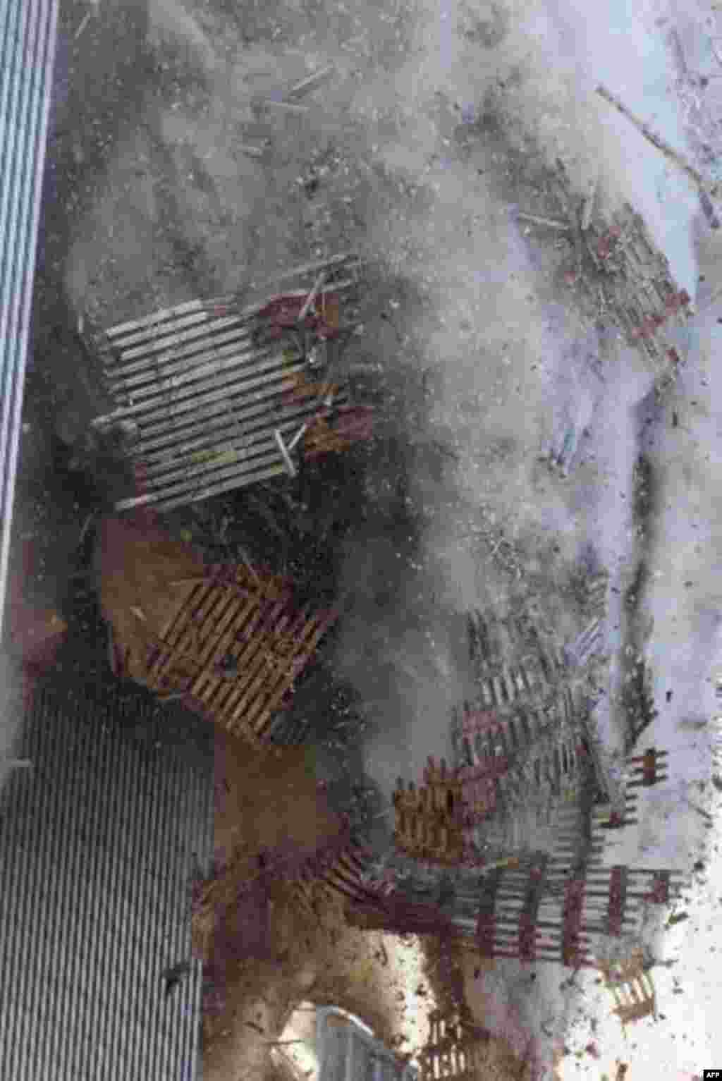 The south tower of New York's World Trade Center collapses Tuesday Sept. 11, 2001. In one of the most horrifying attacks ever against the United States, terrorists crashed two airliners into the World Trade Center in a deadly series of blows that brought