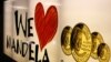 A banner advertises gold coins with the image of former South African President Nelson Mandela, Johannesburg, December 9, 2012. 
