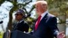 President Donald Trump gestures during a news conference with President Muhammadu Buhari in the Rose Garden of the White House, April 30, 2018, in Washington. 