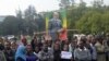 A woman joins others as they wait for the remains of Ethiopia's Prime Minister Meles Zenawi to arrive in Ethiopia's capital Addis Ababa, August 21, 2012.