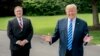 President Donald Trump, accompanied by Secretary of State Mike Pompeo, left, speaks to reporters on the South Lawn outside the Oval Office in Washington, June 1, 2018, after meeting with former North Korean military intelligence chief Kim Yong Chol. After the meeting, Trump announced that the summit with North Korea would go forward.