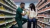 FILE - A woman receives the Pfizer-BioNTech COVID-19 vaccine as a booster dose at Skippack Pharmacy in Schwenksville, Pennsylvania, August 14, 2021.