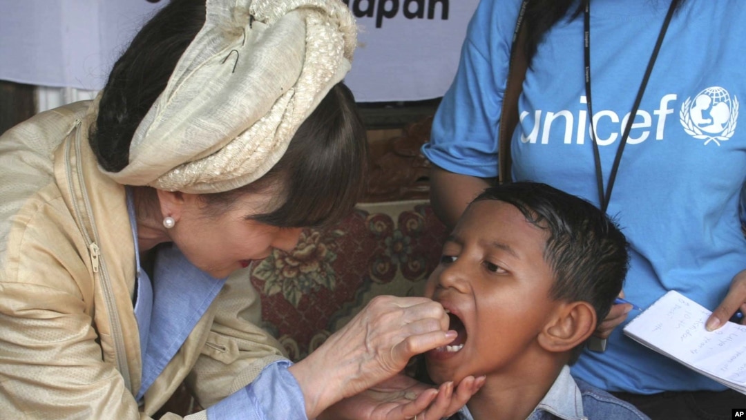 FILE - Renowned Japanese actress Tetsuko Kuroyanagi who is a UNICEF Goodwill Ambassador gives an Indonesian boy a measles vaccination Thursday Feb. 3, 2005 in the remote village of Keudai Tenom on Aceh's West coast.