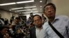 FILE - Freed Hong Kong bookseller Lam Wing-kee, right, is accompanied by pro-democracy lawyer Albert Ho after giving a news conference in Hong Kong, June 16, 2016. 