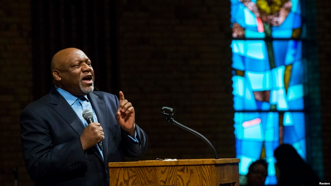 Pastor Tommie Pierson preaches during a Thanksgiving service that discussed the reaction in Ferguson, Missouri, to developments in the Michael Brown case, Nov. 27, 2014. 