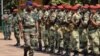The commander of regional African force Jean-Felix Akaga reviews troops, on January 2, 2013 in Bangui