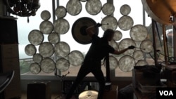 William Close has invented nearly 100 instruments, including a percussive device with dozens of drum heads. (M O'Sullivan/VOA)