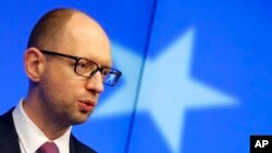 Ukraine's Prime Minister Arseniy Yatsenyuk speaks during a media conference at an EU summit in Brussels on March 6, 2014.
