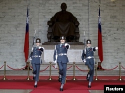 FILE - Guards of honor parade at the Chiang Kai-shek Memorial Hall in Taipei, Taiwan, Jan. 17, 2016.