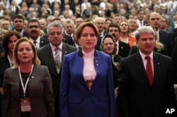 Meral Aksener, a former interior minister and deputy parliament speaker, center, attends her party's first meeting in Ankara, Turkey, Oct. 25, 2017. The new party of Aksener, 61, hopes to challenge President Recep Tayyip Erdogan in elections set for 2019.