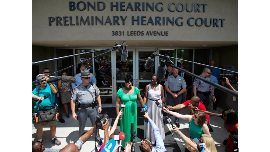 Nadine Collier, left, the daughter of Ethel Lance, one of the nine people killed in Wednesday's shooting at Emanuel AME Church, speaks to the media about her mother following the bond hearing for the suspected gunman, in North Charleston, S.C., June 19, 2