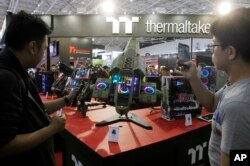 Visitors review Thermaltake's MFC 2 2nd Place MOD during the Computex Taipei, one of the world's largest IT expos, in Taipei, Taiwan, June 5, 2018.