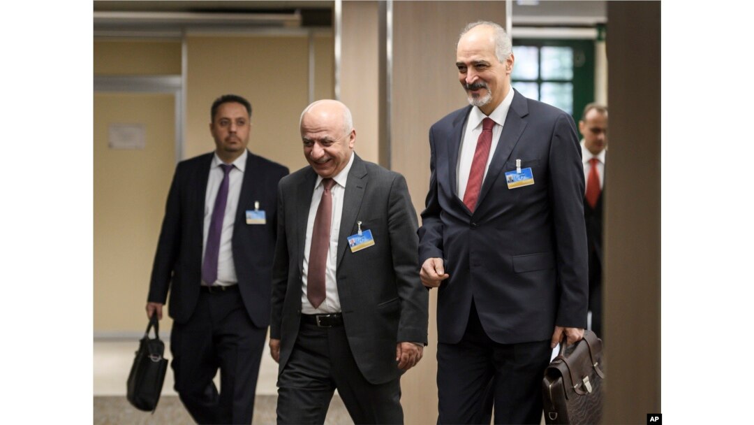 Syrian ambassador to the United Nations and head of the government delegation Bashar al-Ja'afari (R) and his delegation arrive for a meeting with the UN Special Envoy for Syria Staffan de Mistura during Intra Syria peace talks, Dec. 14, 2017, in Geneva.