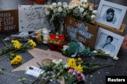 A crown, flowers and pictures are shown placed at Aretha Franklin's star on Hollywood Boulevard in Los Angeles, California, Aug. 16, 2018.