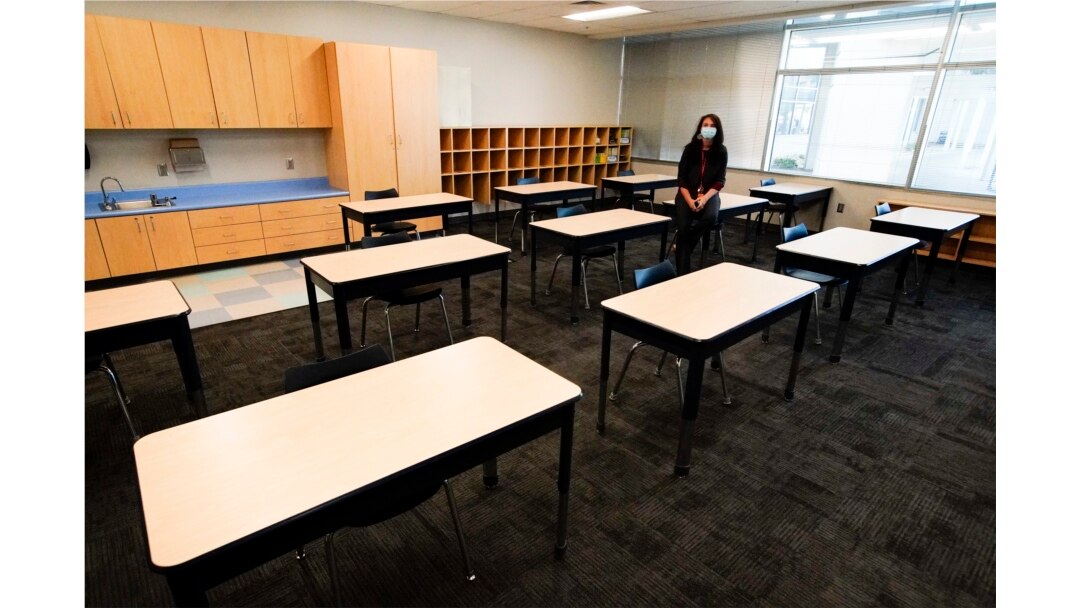 FILE - Principal Susan Stevens talks to the media during a demonstration of a socially-distanced classroom at A.J. Whittenberg Elementary School of Engineering Monday, July 20, 2020, in Greenville, S.C. (AP Photo/Chris Carlson)