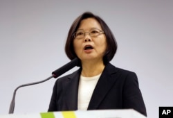 FILE - Tsai Ing-wen, announces that Lin Chuan is her choice for premier at their Democratic Progressive Party headquarters in Taipei, March 15, 2016.