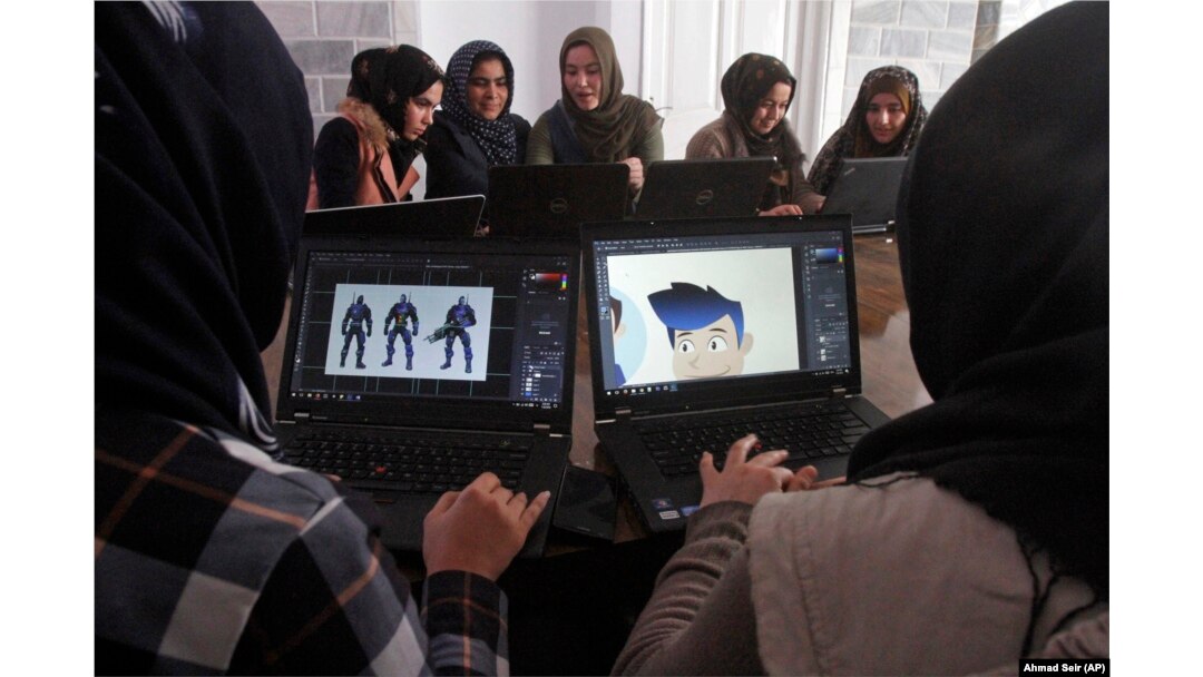 In this Monday, Jan. 22, 2018 photo, Afghan coders practice at the Code to Inspire computer training center in Herat province, western Afghanistan.