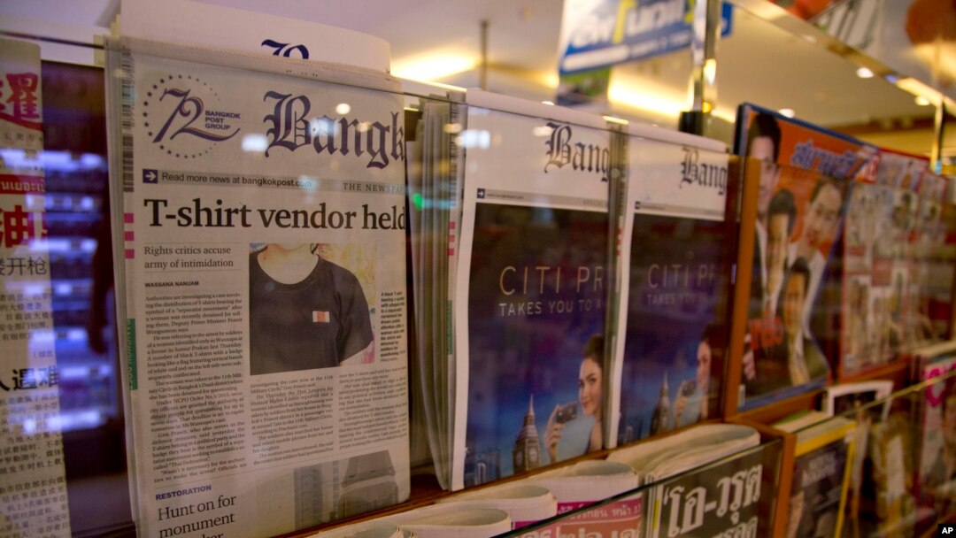 Thailand's Bangkok Post newspaper depicting a cover story on detention of a vender who sold black t-shirts, bearing a symbol allegedly linked to a movement promoting a federal republic, is displayed in a newspaper stall in Bangkok, Thailand, Tuesday, Sept. 11, 2018.