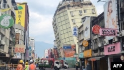 This picture released by Taiwan’s Central News Agency on April 23, 2024, shows the Full Hotel building in Hualien, which had been previously damaged in the April 3 earthquake, tilting further to one side after a series of earthquakes overnight.