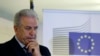 EU Migration Commissioner Dimitris Avramopoulos, shown at a news conference after a meeting with local officials in Athens on June 12, 2015, says that "now is the moment for actions" on migrant redistribution. "We should not waste any more time."