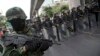 Thai soldiers guard during a protest against the coup in Bangkok, Thailand Saturday, May 24, 2014.