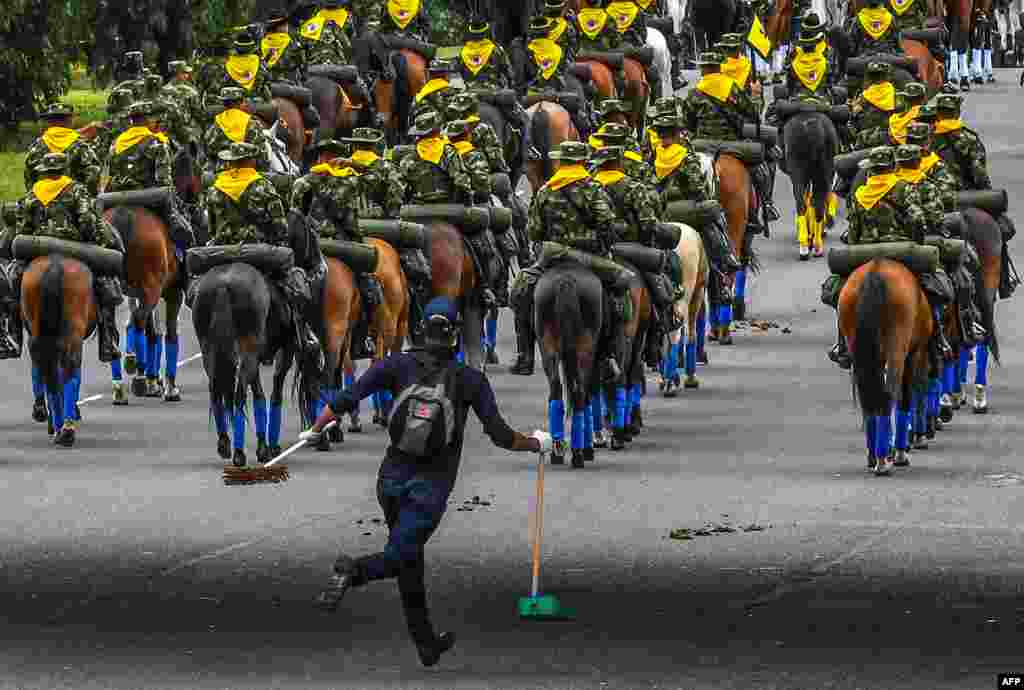 Colombian mounted soldiers take part in a military parade to celebrate the 207th anniversary of the independence, in Bogota.