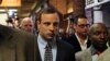 Oscar Pistorius leaves after court proceedings at the Pretoria Magistrates court, June 4, 2013.