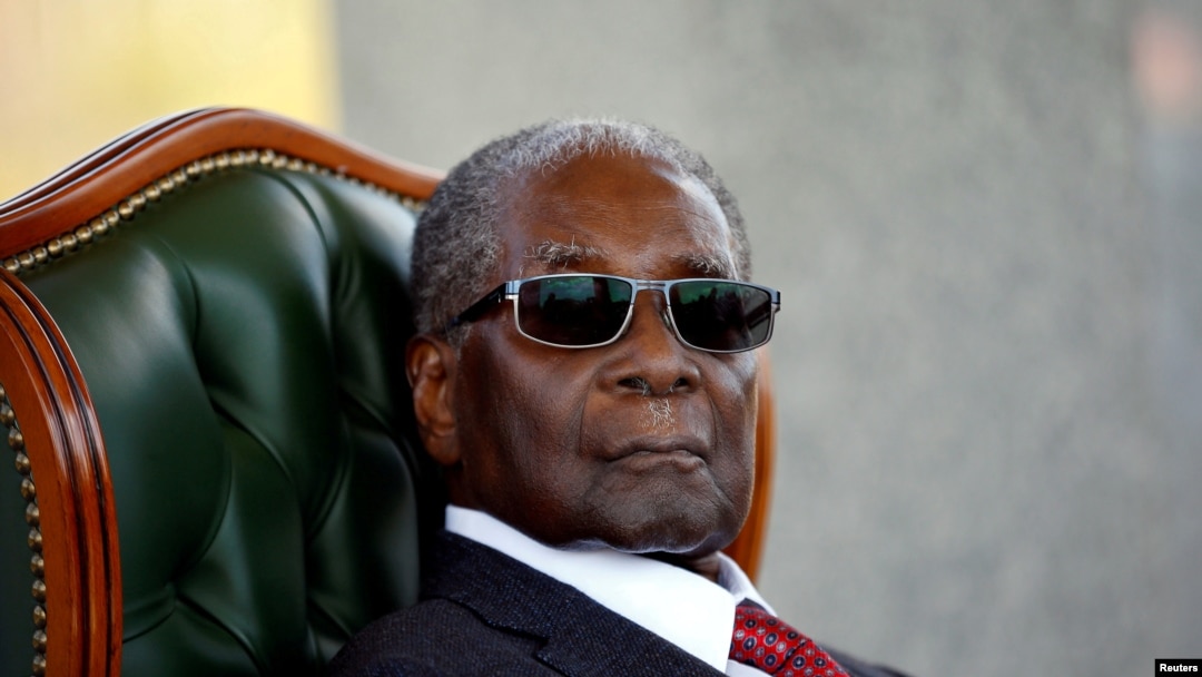 FILE - Zimbabwe's former president Robert Mugabe looks on during a press conference at his private residence nicknamed "Blue Roof" in Harare, Zimbabwe, July 29, 2018.