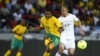 South Africa's Kagisho Dkgacoi (L) is challenged by Algeria's Adlane Guedioura during their international friendly soccer match in Soweto, January 12, 2013, in preparation for the 2013 Africa Cup of Nations. 